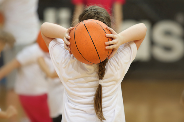 Young girl playing basketball