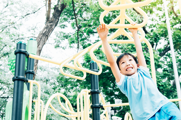 Child on monkey bars