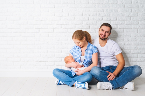 Family sitting together in white home