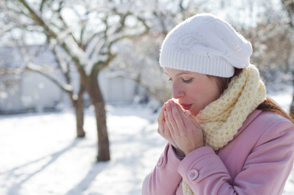 Woman warming hands