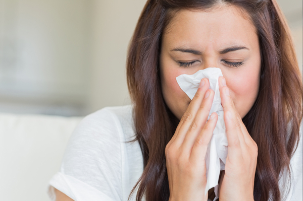 Woman Sneezing