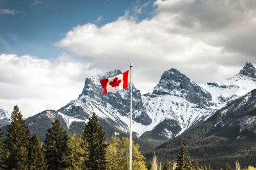 canada flag mountains background